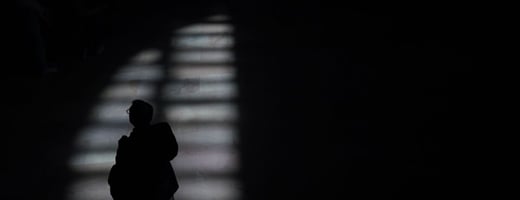 A person walks through the afternoon shadows at Grand Central Terminal in New York City on April 11, 2022. Photographer: Timothy A. Clark/AFP via Getty Images